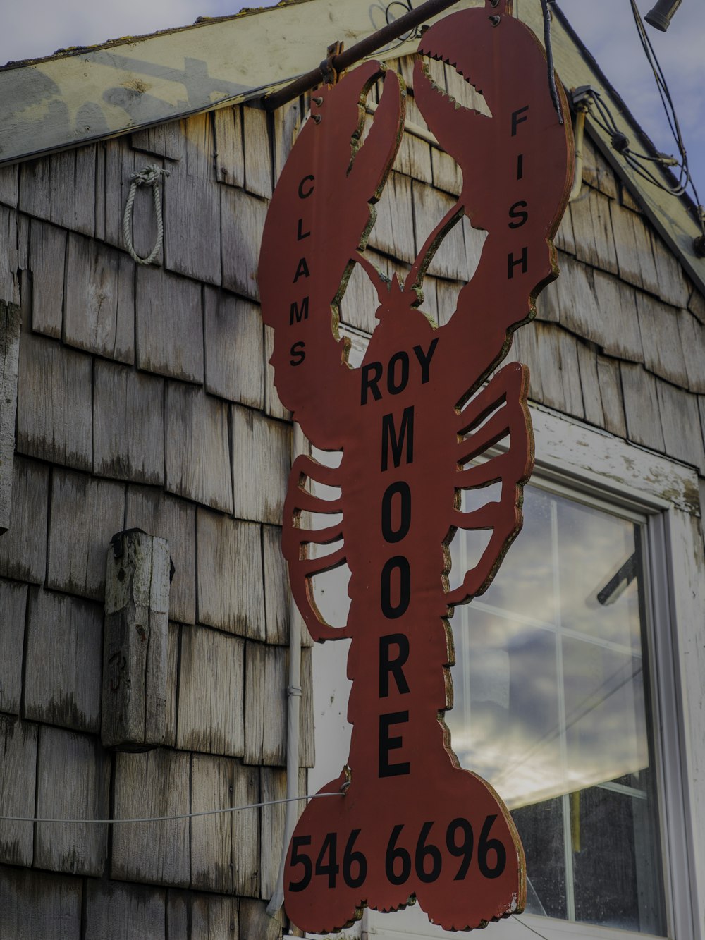 a large lobster sign on the side of a building