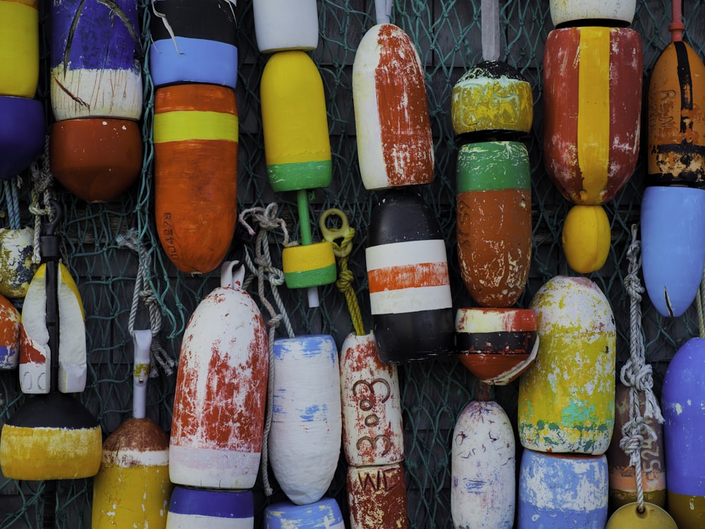 a bunch of buoys hanging on a wall
