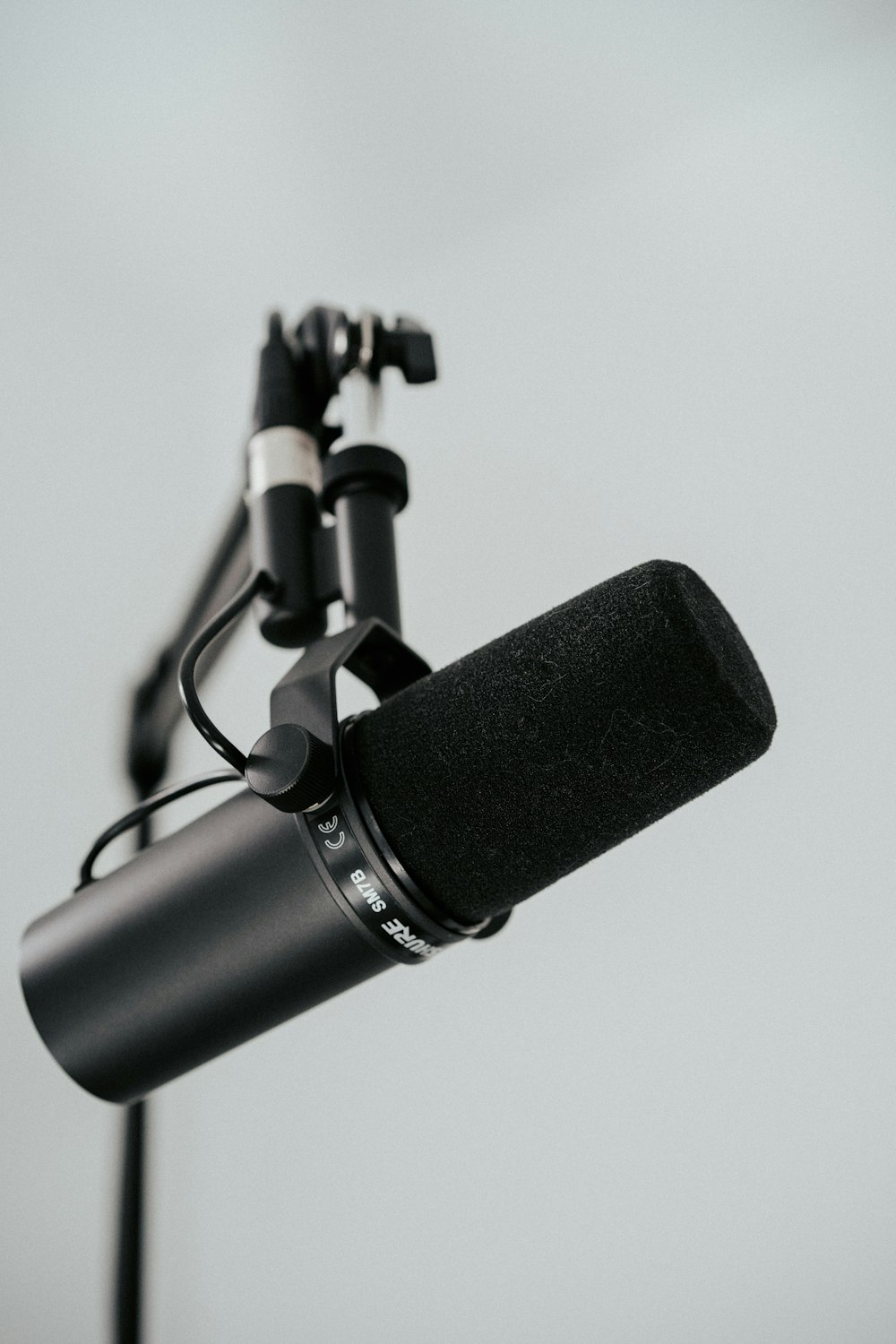 a microphone with a tripod attached to it