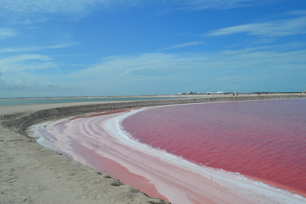 a body of water that is red and pink