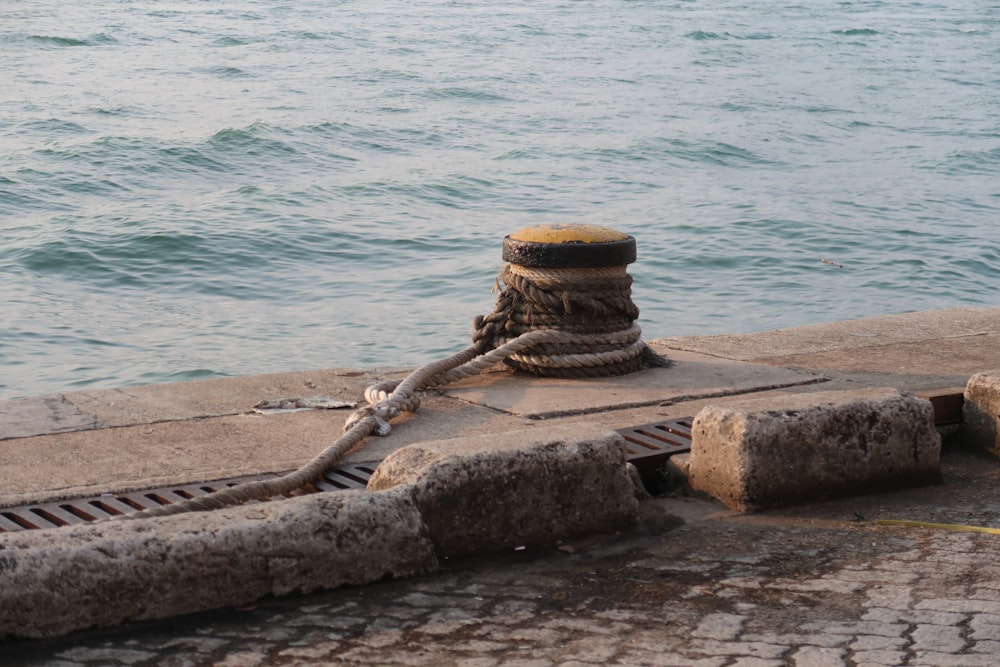 a rope on a dock near the water