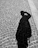 a shadow of a person on a cobblestone street