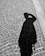 a shadow of a person on a cobblestone street