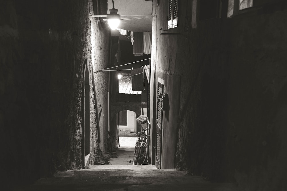 a bicycle parked in an alley