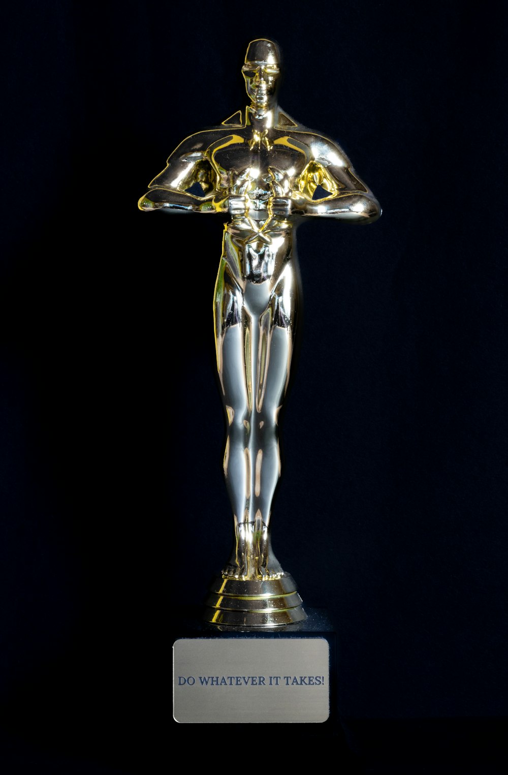 a silver and gold trophy