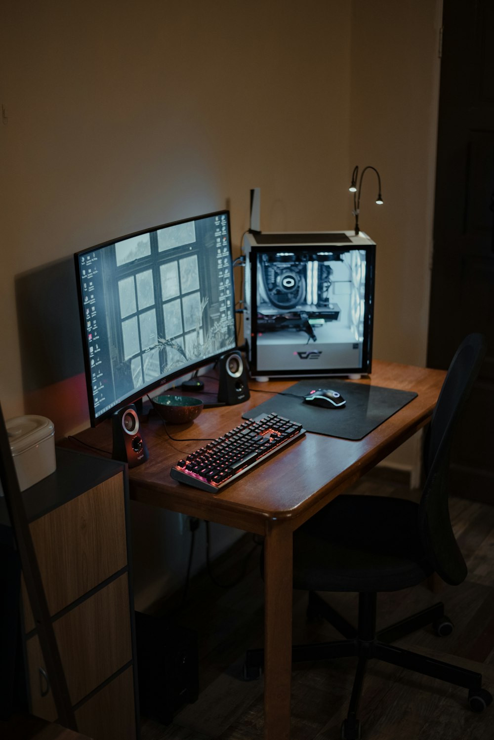 a desk with a computer and a keyboard on it