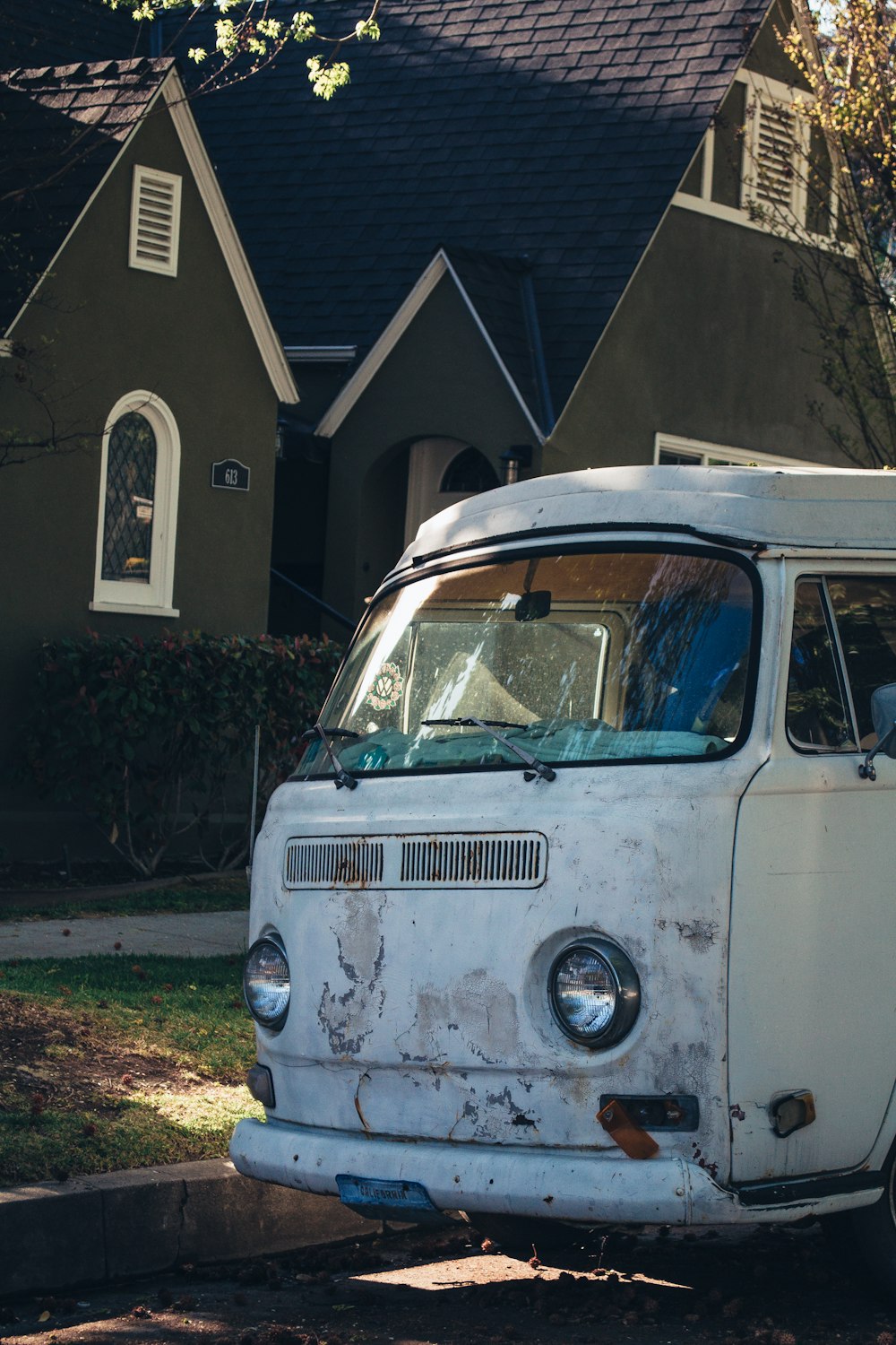 a white van parked in front of a house