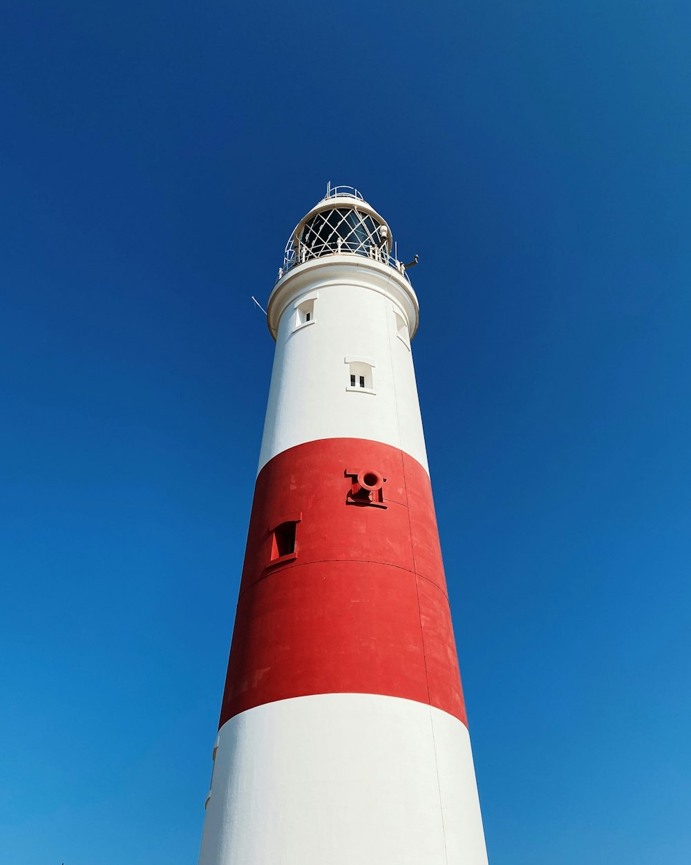 a lighthouse against a blue sky