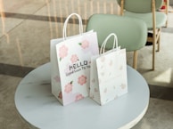 a couple of shopping bags on a table