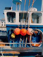 Close-up of a fishing boat’s deck with nets and equipment ready for the catch.