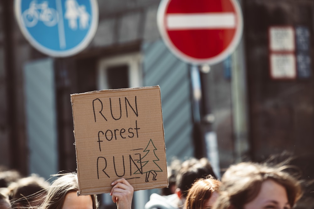 a person holding a sign