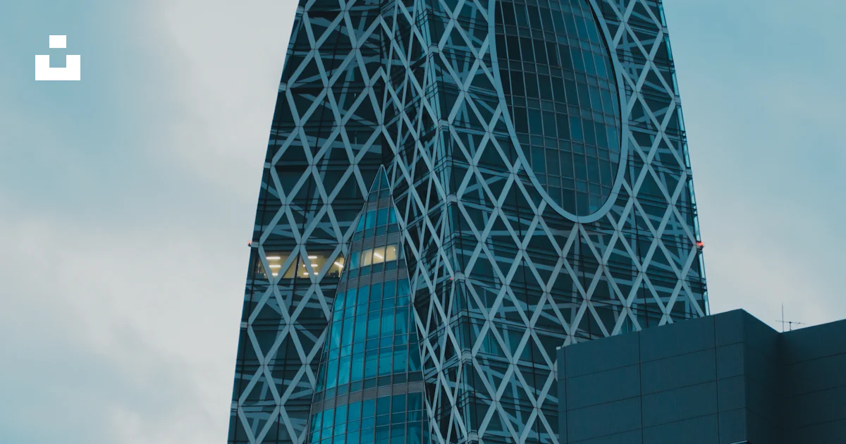 Moda Building A tall glass building with Moda Tower in the background photo – Free 1 ...