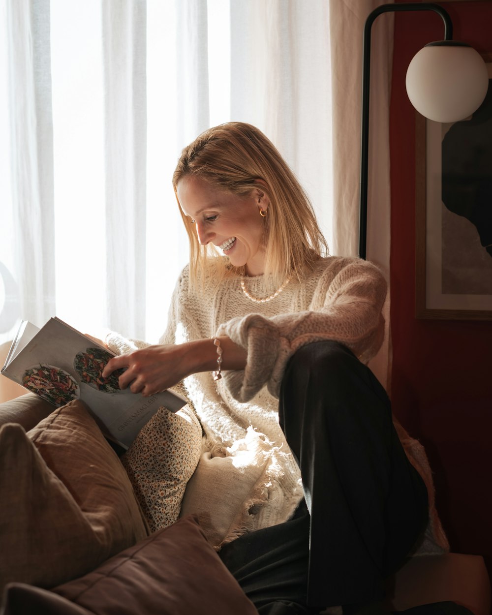 a woman sitting on a couch