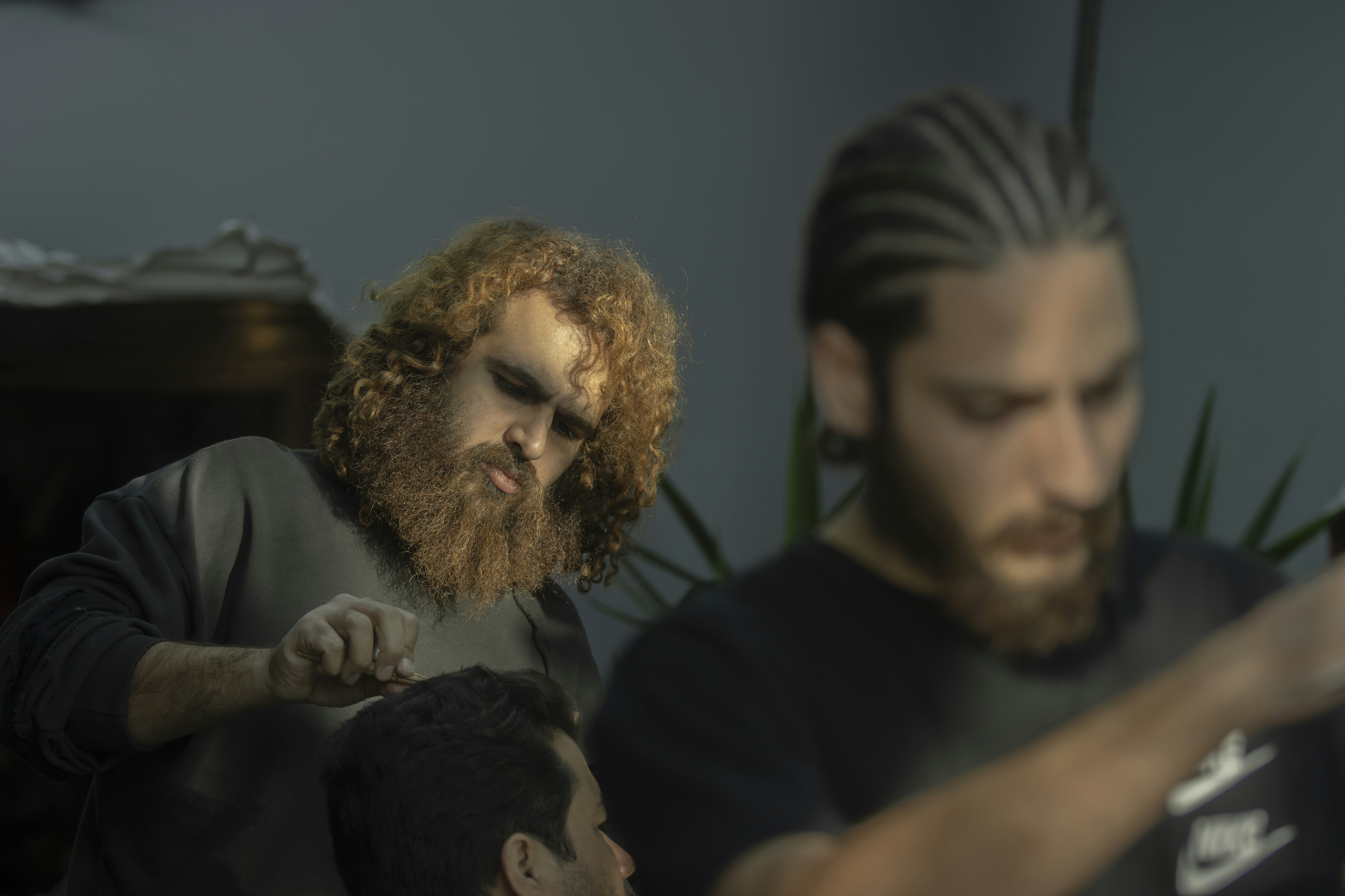 a person with a beard and another man with the mouth open (Photo by mostafa meraji on Unsplash)