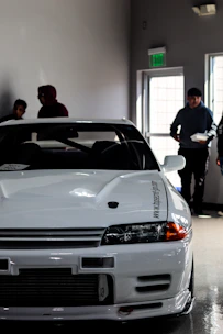 A pristine Silverstone sports car carefully covered and stored in a climate-controlled garage.