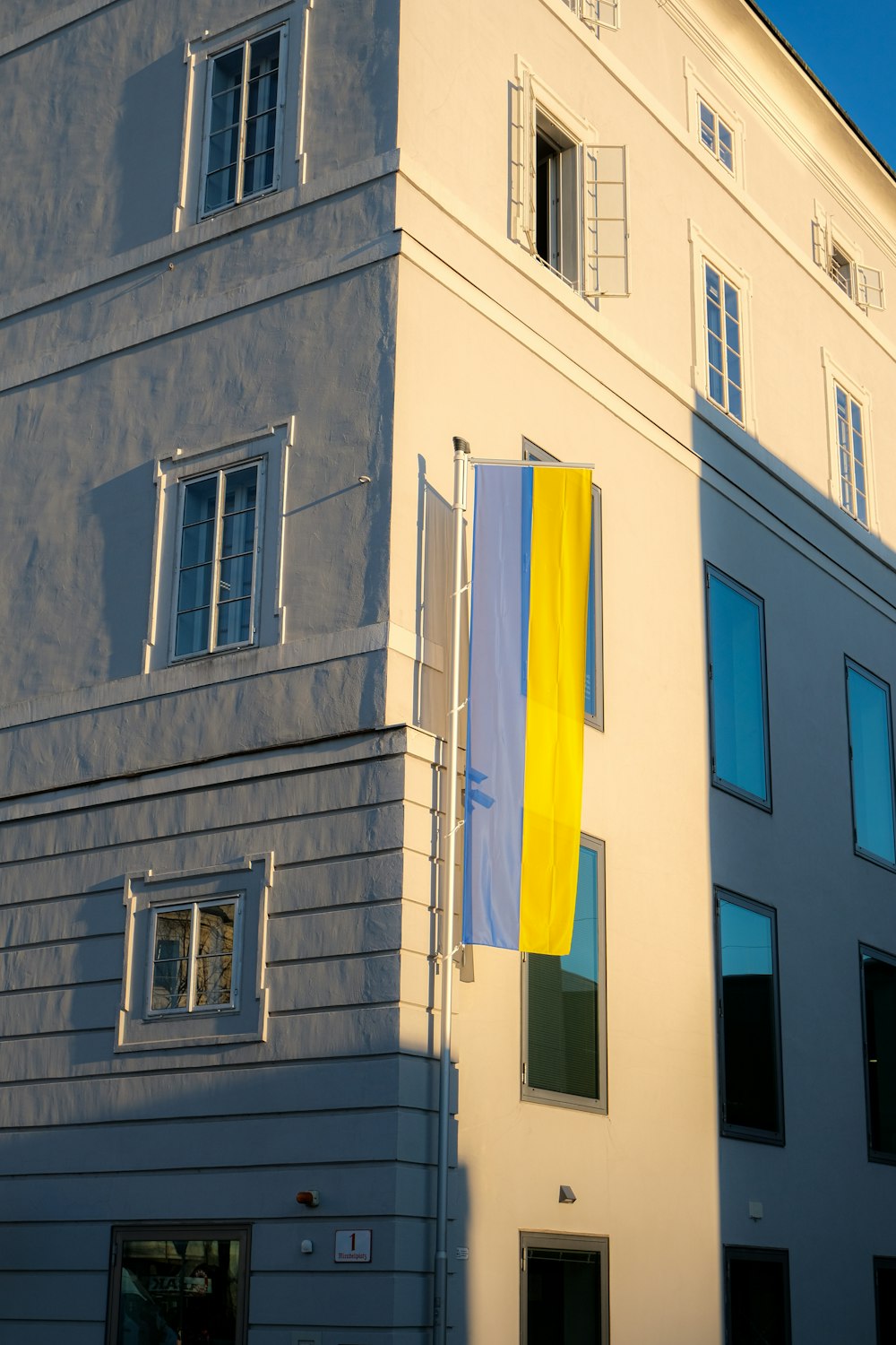 a building with a flag on the side