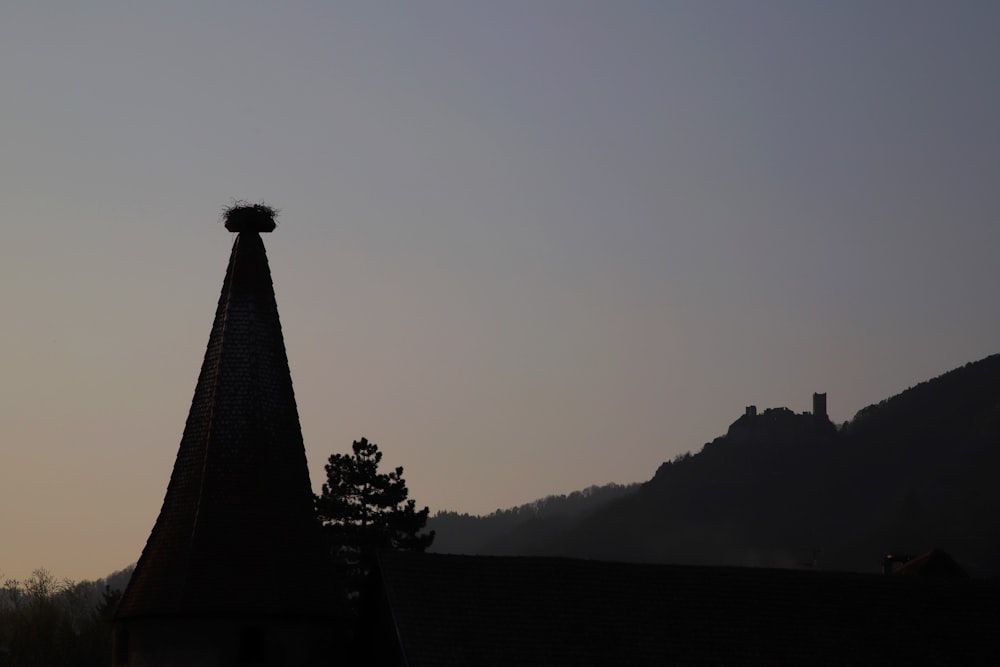a silhouette of a tower