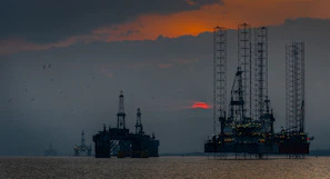 a group of oil rigs in the ocean