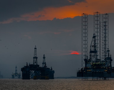 a group of oil rigs in the ocean