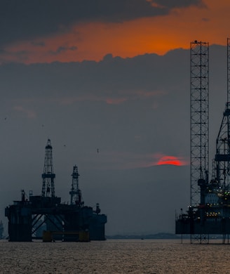 a group of oil rigs in the ocean