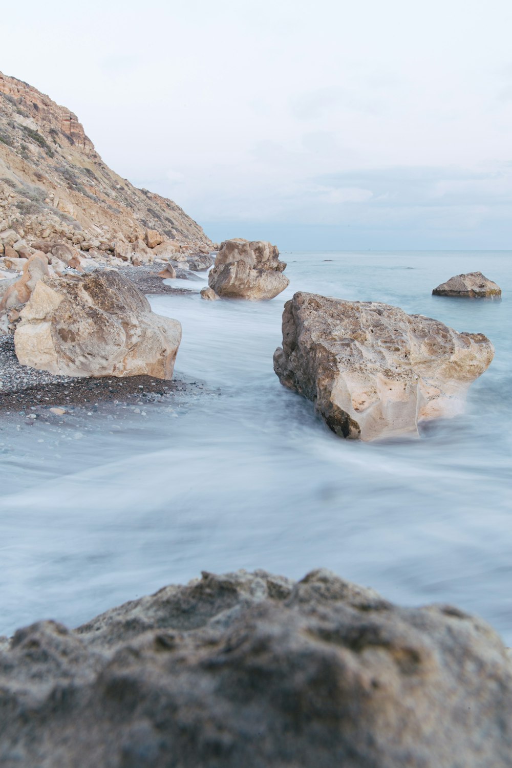 a body of water with rocks in it