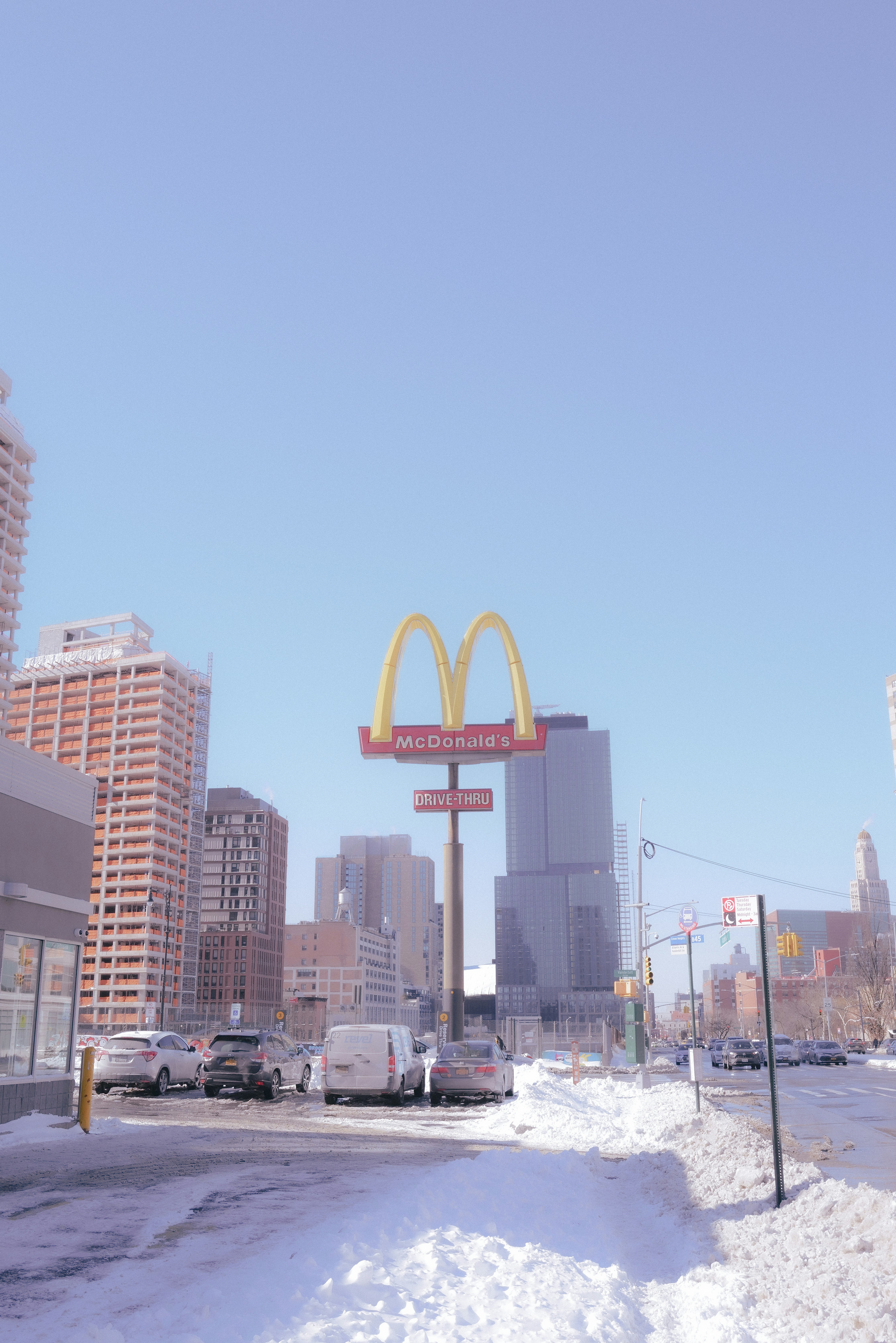 a city street with cars and buildings