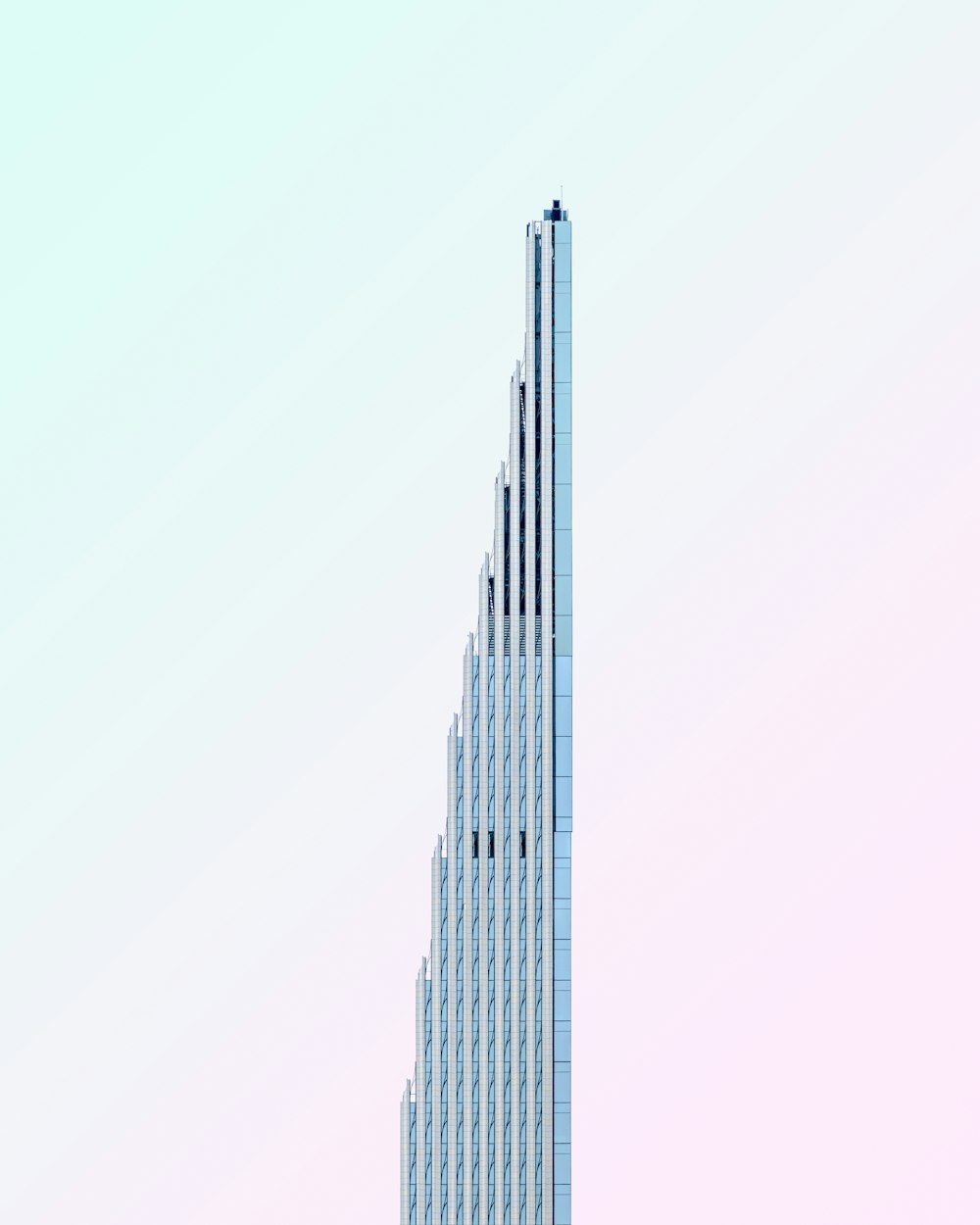 a tall building with a bird on top