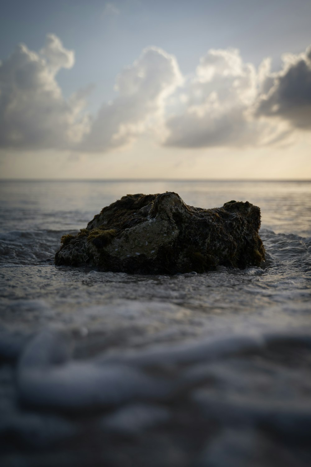 a large rock in the ocean