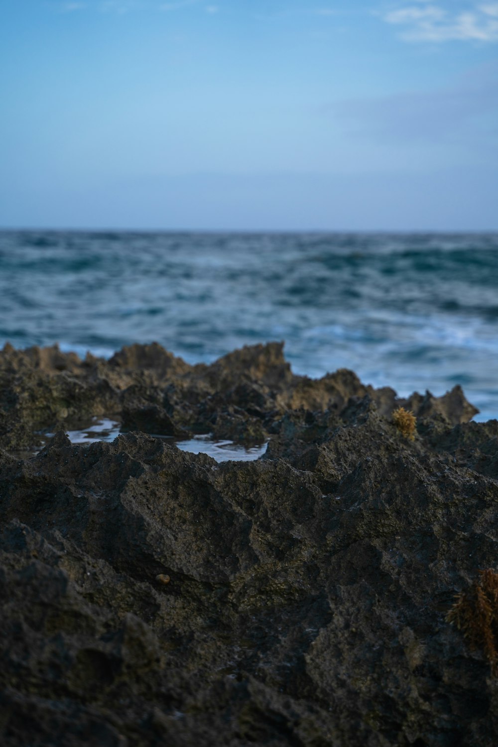 a rocky beach with waves crashing