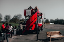 Group of passengers boarding a spacious 72-seater coach at Gatwick South Terminal.