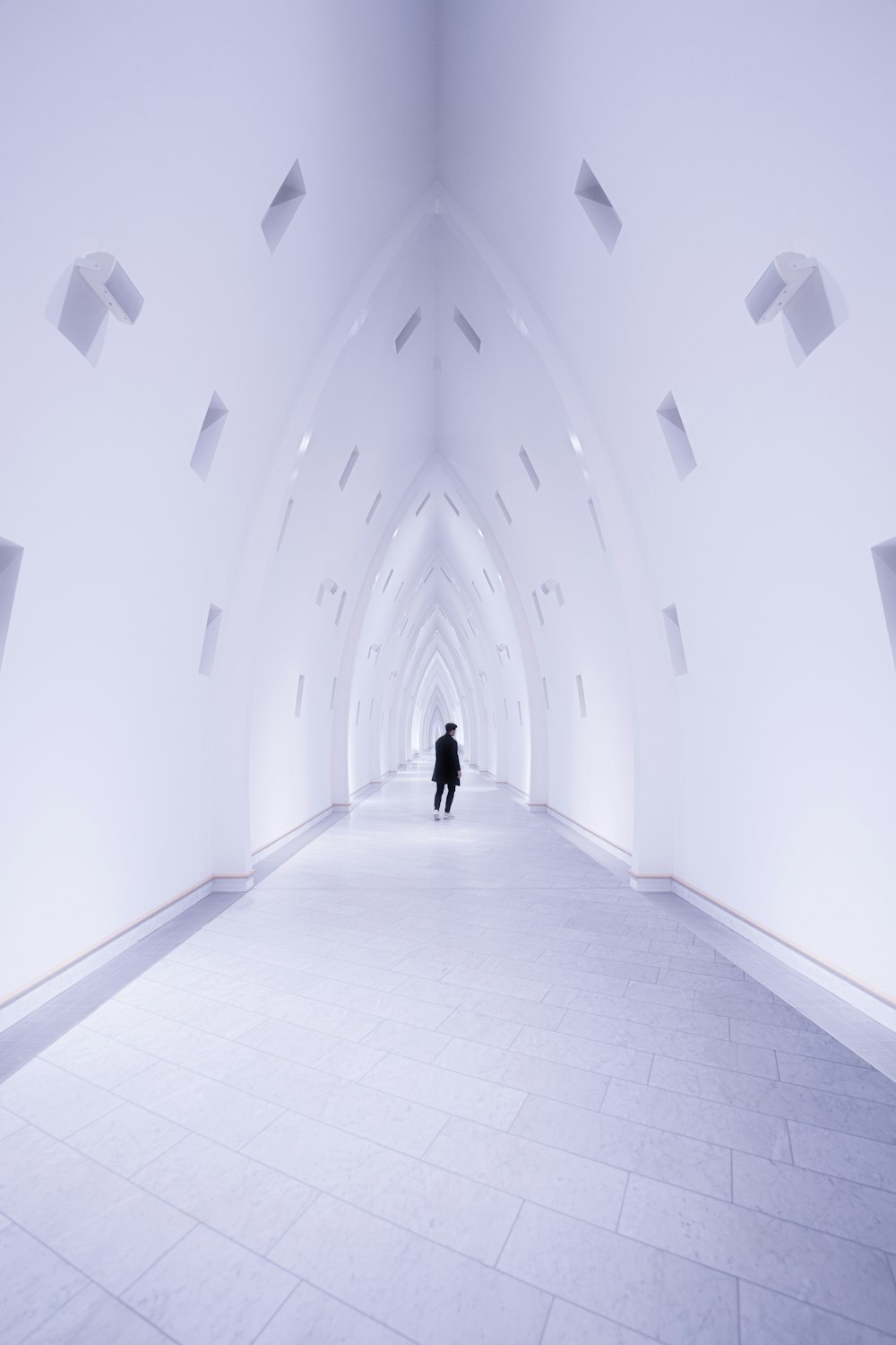 a person walking through a tunnel