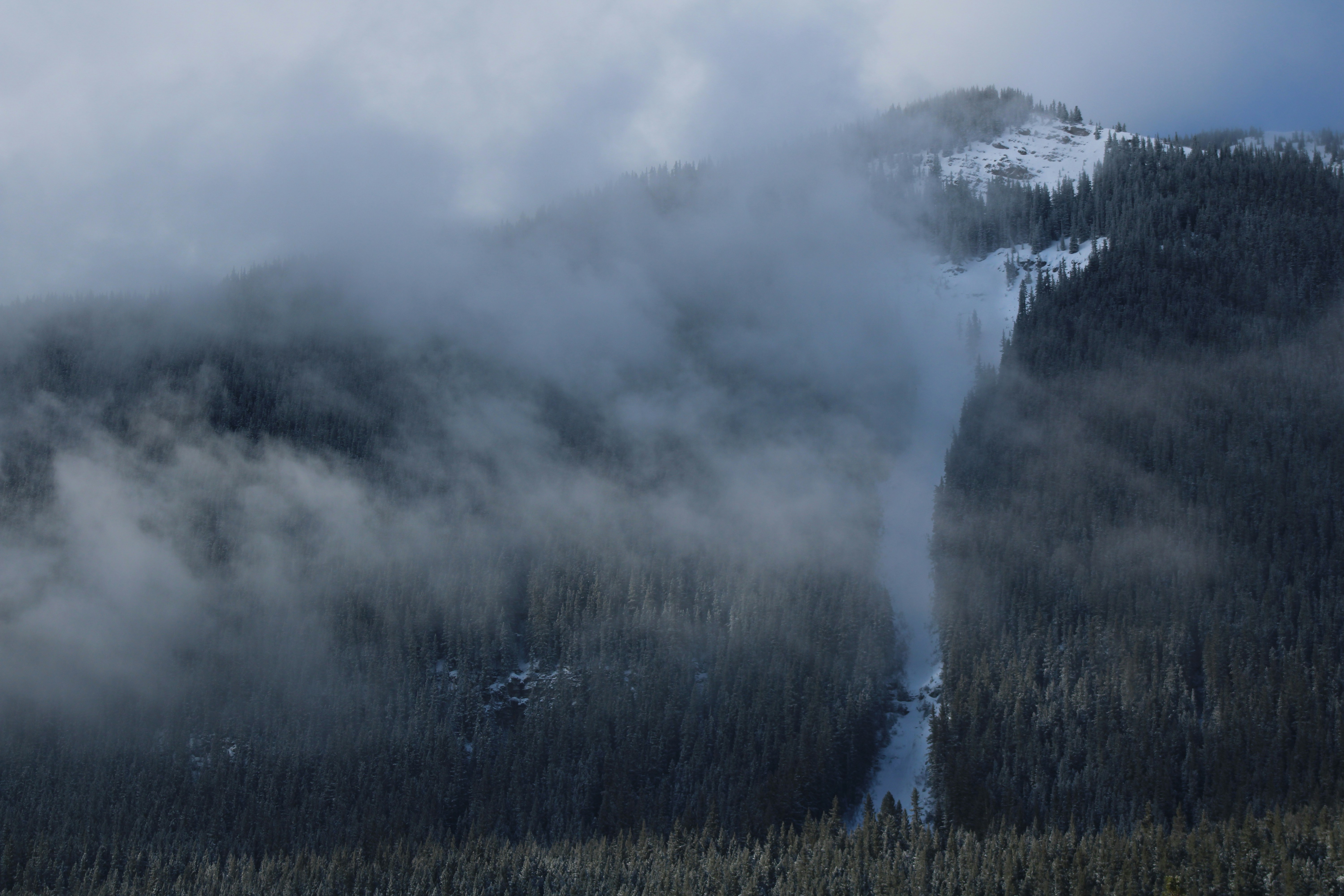 a mountain with clouds