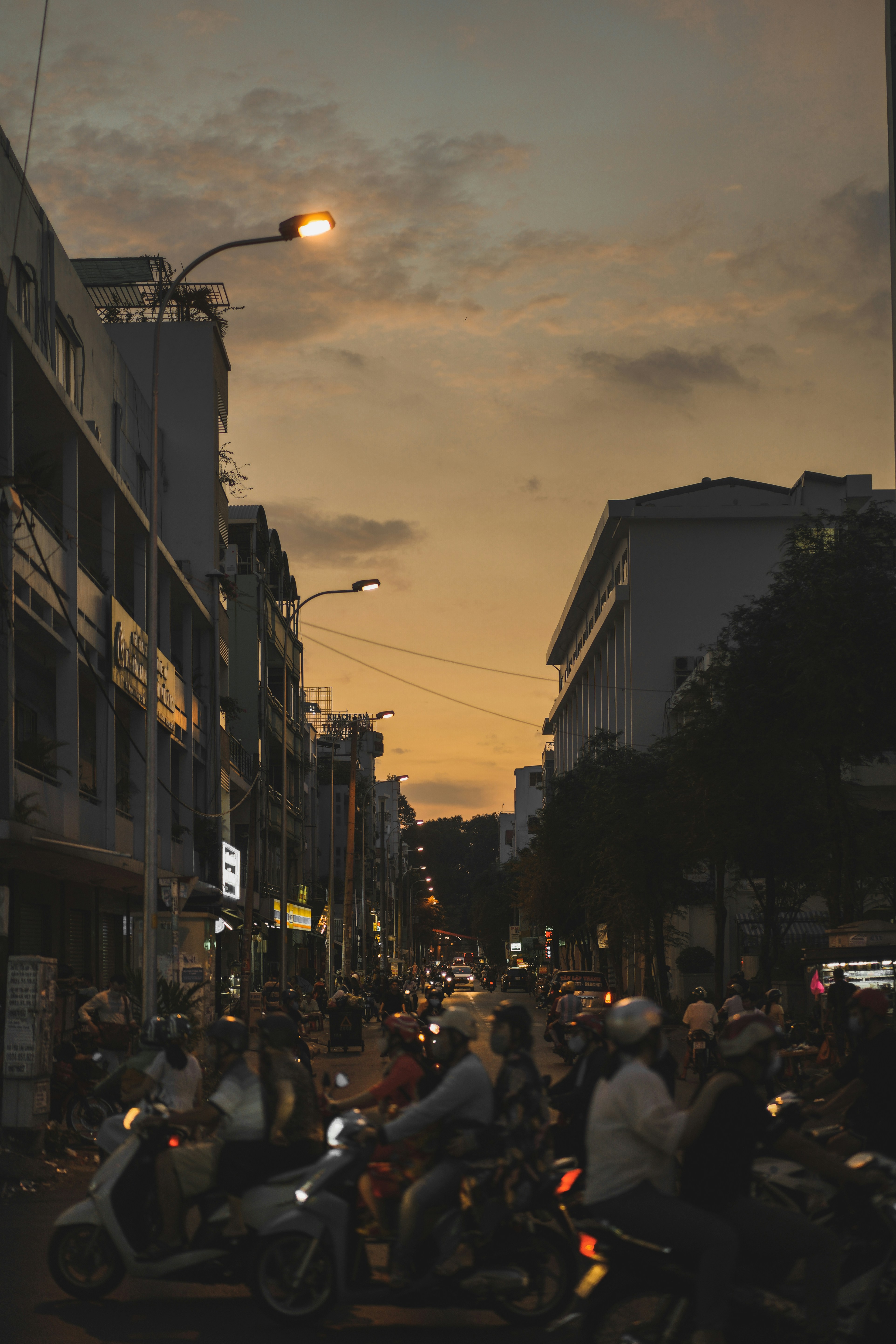 a busy street with people on motorcycles
