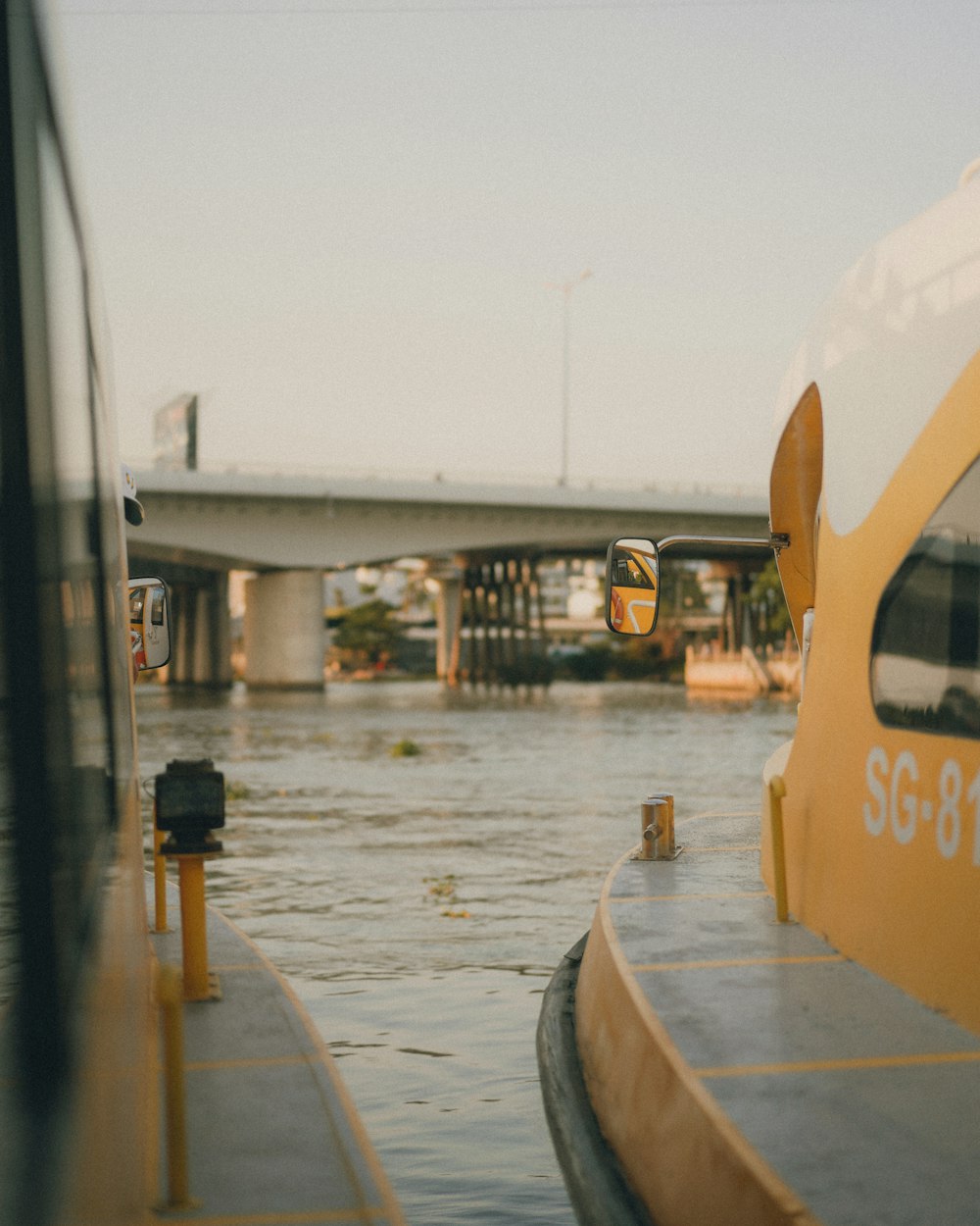 a flooded road with a bus