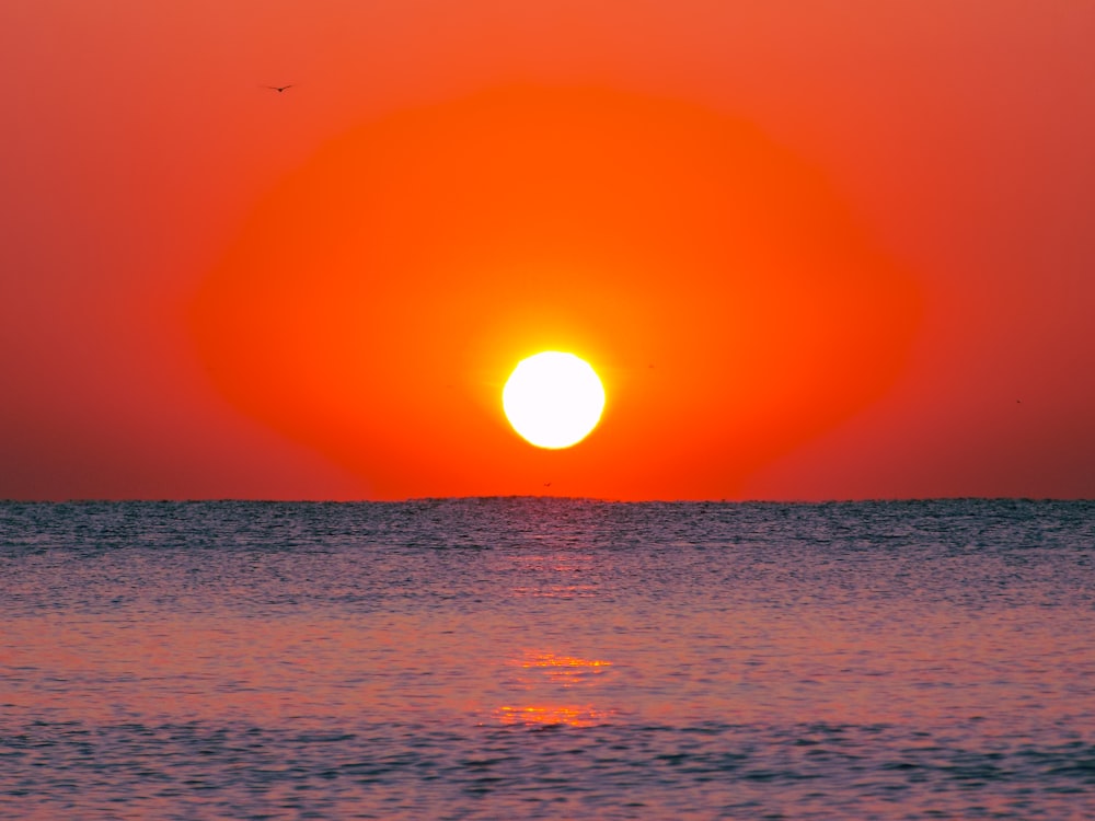 a sunset over the ocean