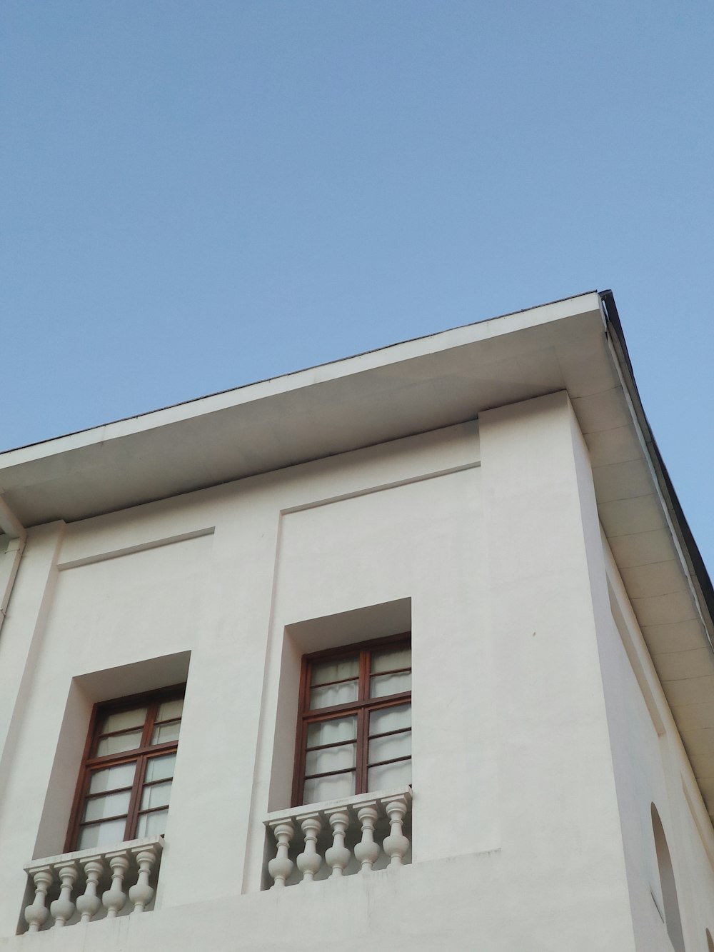 a white building with a balcony