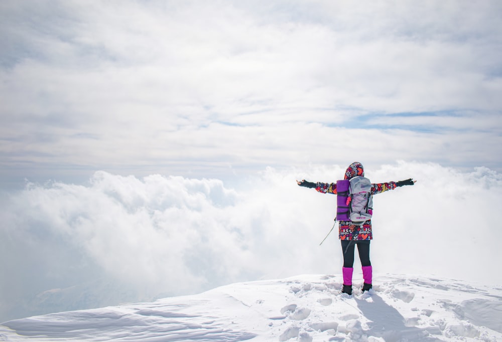 a man standing on a snowy mountain