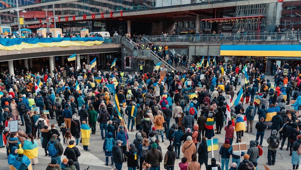 a crowd of people in a large building