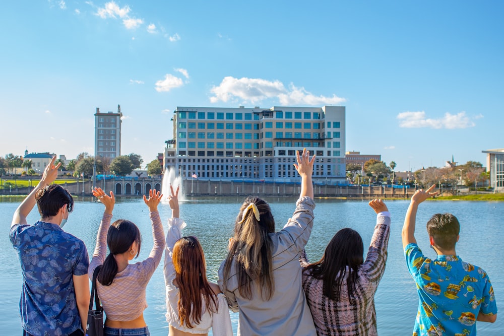 a group of people raising their hands