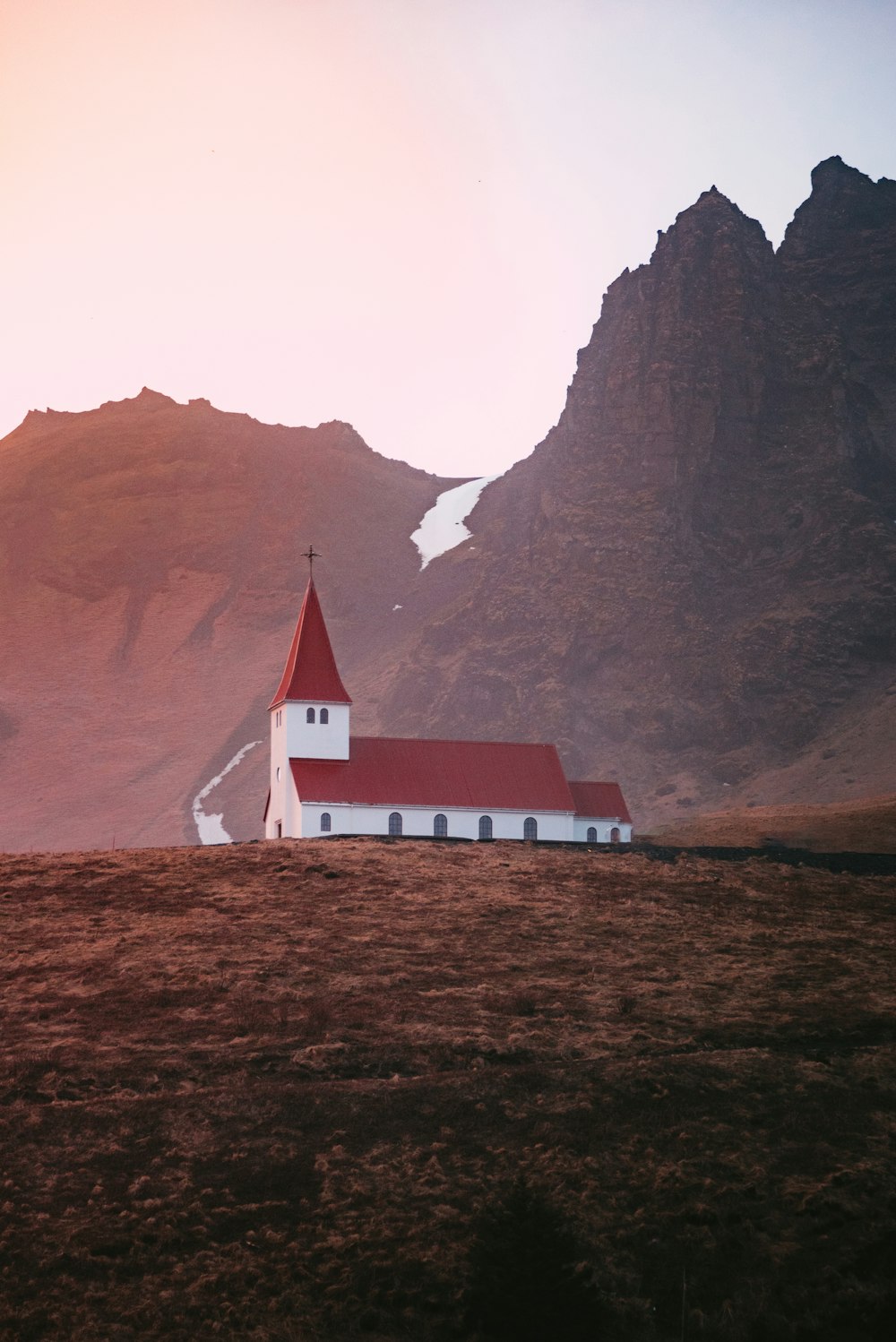 a house with a mountain in the background