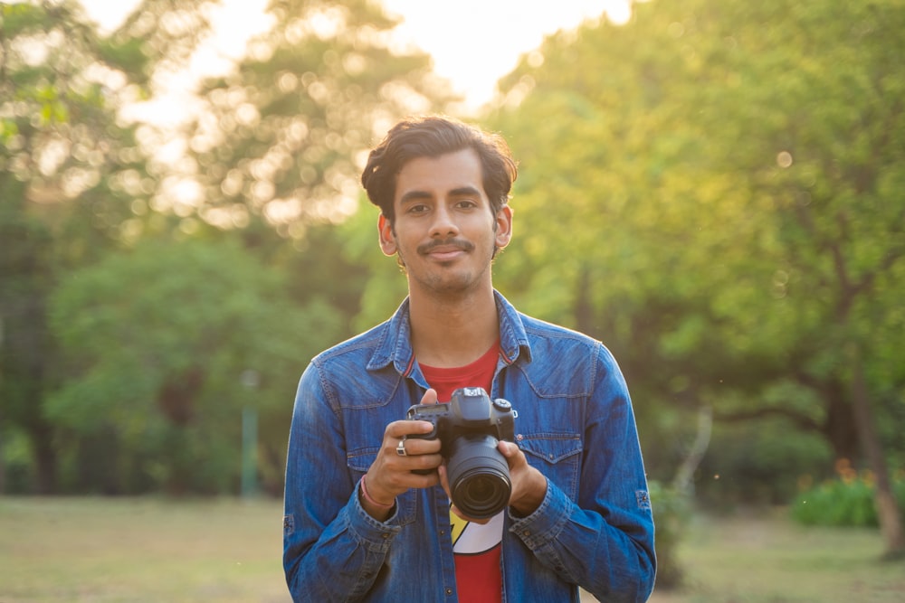 a man holding a camera