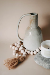 a white jug with white balls