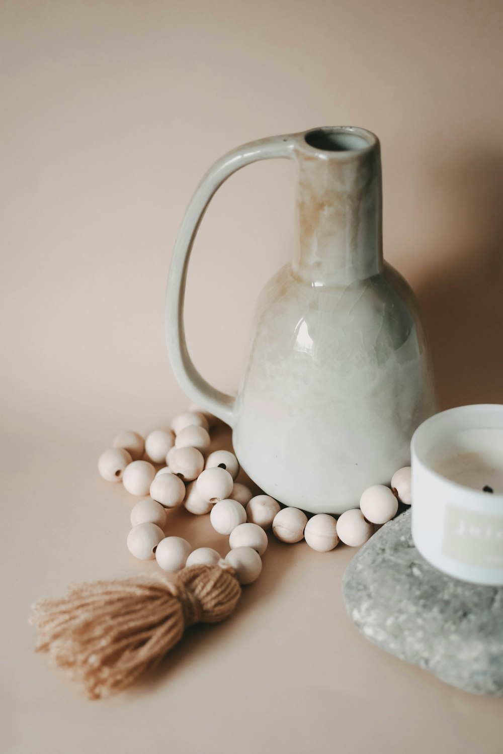 a white jug with white balls