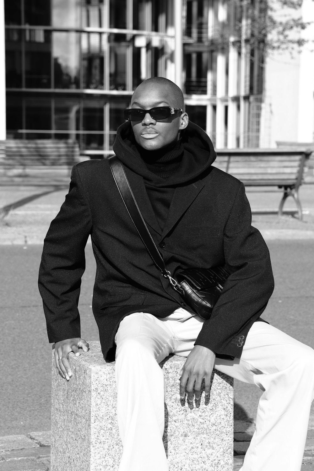 a man wearing sunglasses and a scarf