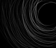 Close-up visualization of Kerr geodesics tracing paths near a spinning black hole's event horizon.