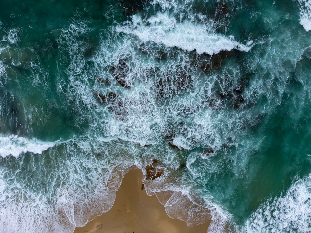 a wave crashing on a beach