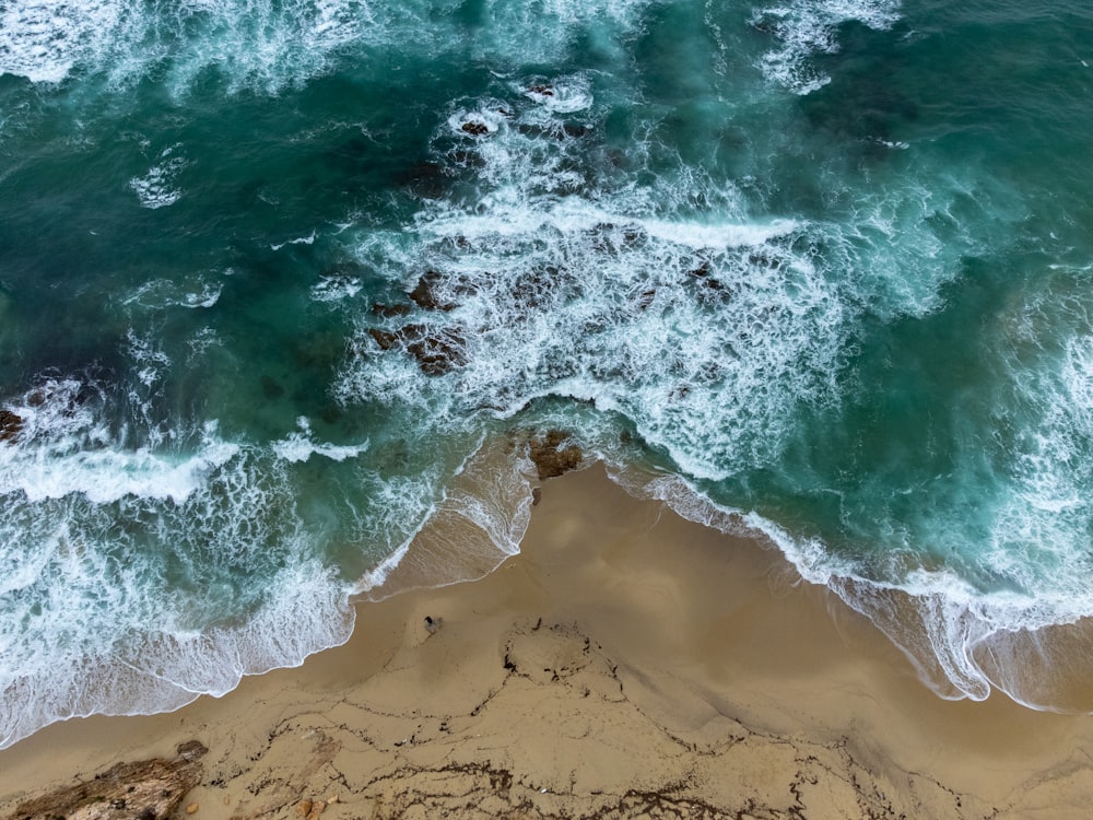 a wave crashing on a beach