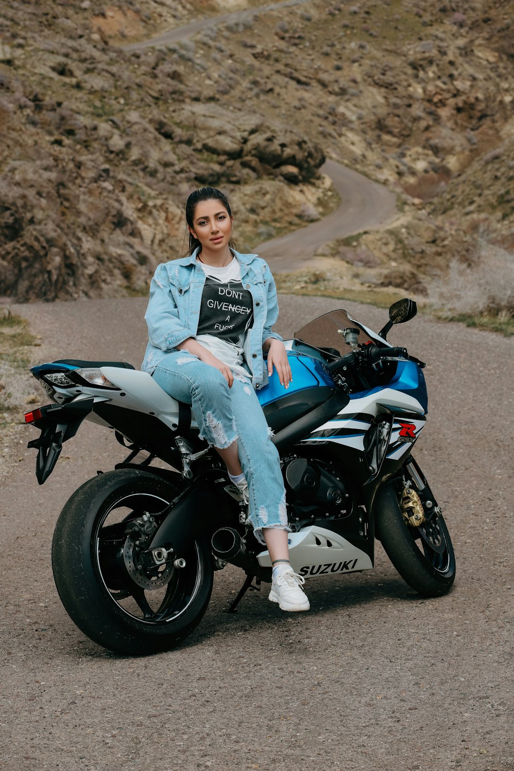 a man sitting on a motorcycle