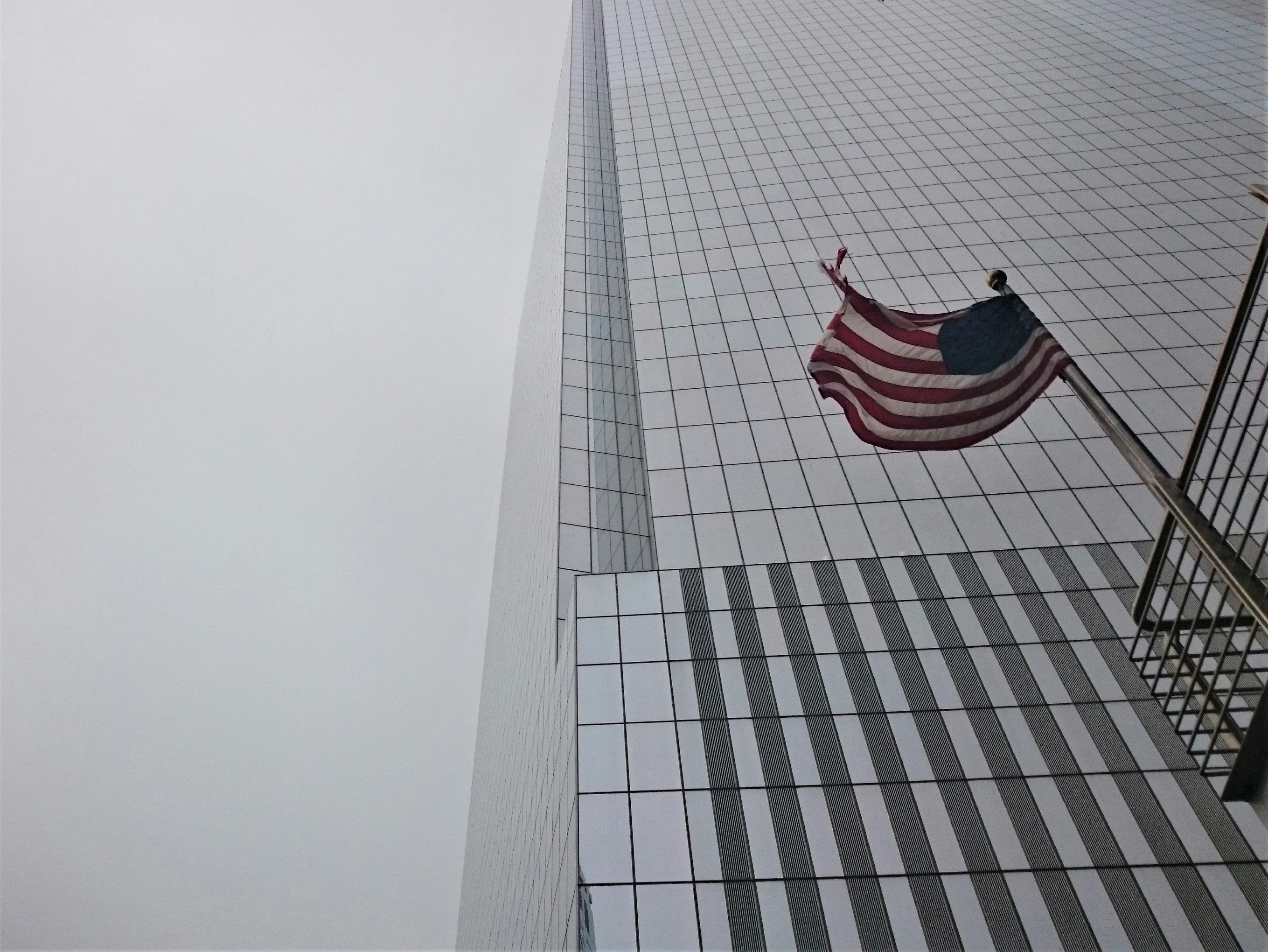 a flag on a tall building