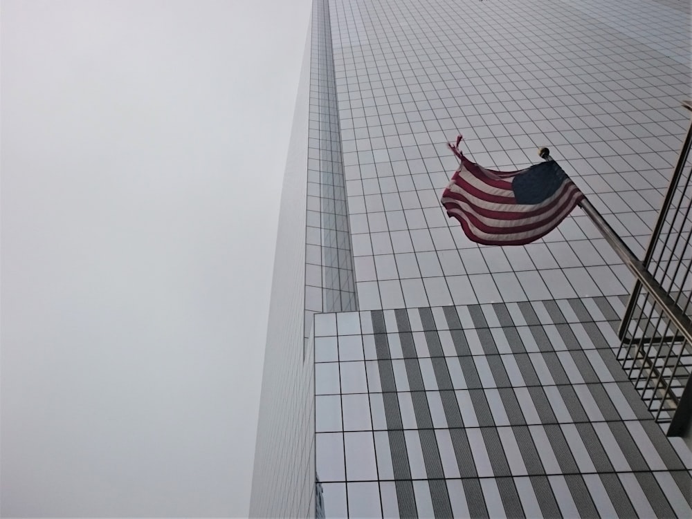 a flag on a tall building